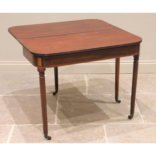 740 - A George III mahogany tea table, the rectangular folding top with rounded corners and a reeded edge,... 