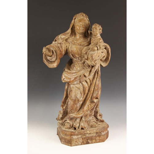 643 - An Italian Baroque style limewood carving of The Madonna and Child, in the 17th century manner, carv... 