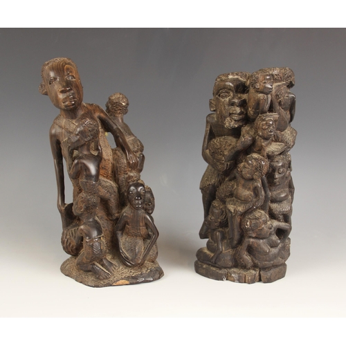 442A - Two Congolese tribal carvings of fertility, each depicting a maternal figure with children, 23cm hig... 