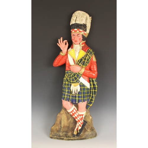 558 - A vintage Scotch Whiskey advertising sign, mid 20th century, modelled as a highlander, painted compo... 