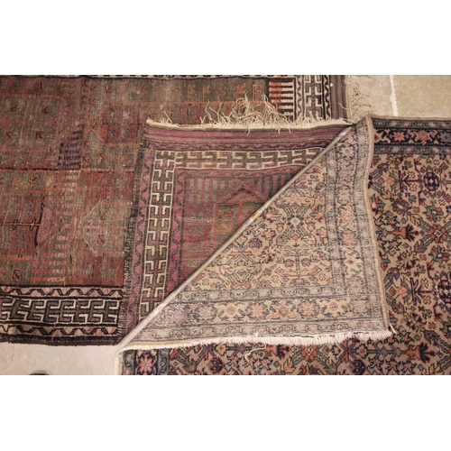 634 - A hand knotted woollen tribal rug, in red, green and brown colourways, the quarter panels with lozen... 