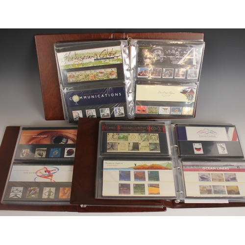 169 - Three Royal Mail Presentation Pack albums, each containing mint commemorative stamps, to include 