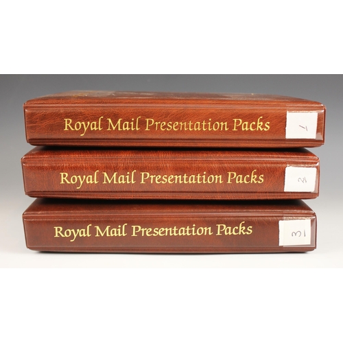 169 - Three Royal Mail Presentation Pack albums, each containing mint commemorative stamps, to include 