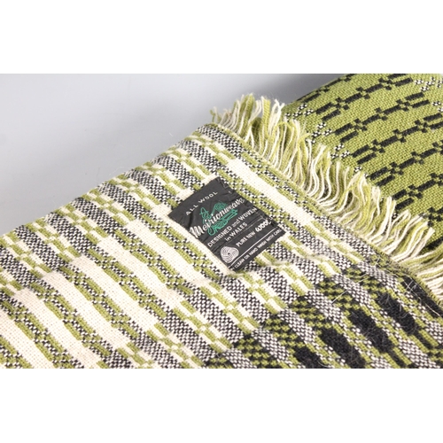 601 - A Welsh blanket by Meirionweave, of unusual linear geometric design in green, black and white, with ... 