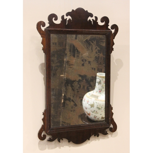 696 - A Regency style fretwork wall mirror, the rectangular mirror plate within a carved surround,  66cm H... 