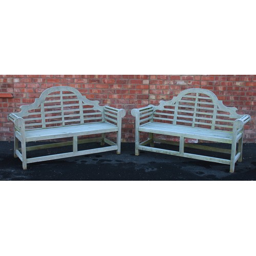 546 - A pair of Lutyens type hardwood benches, late 20th century, each with an arched back extending to sc... 