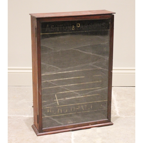 557 - An early 20th century 'Ashtons & Parsons' homeopathic table top display case, the single glazed door... 