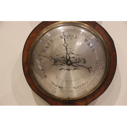 682 - A mid 19th century mahogany wheel barometer by 'Britton Stamford' the swans neck pediment above a si... 