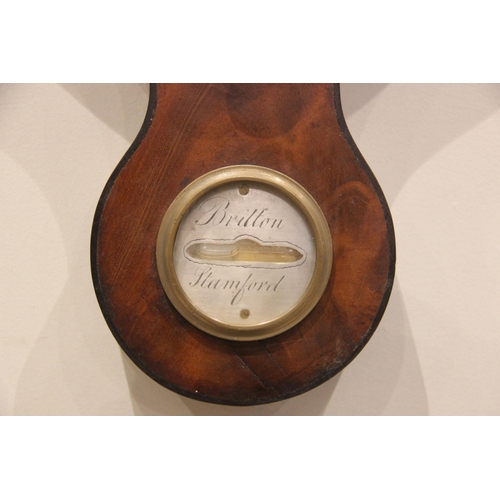 682 - A mid 19th century mahogany wheel barometer by 'Britton Stamford' the swans neck pediment above a si... 