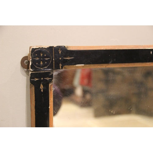 697 - An Aesthetic manner rectangular wall mirror, late 19th century, the ebonised and canted frame with g... 