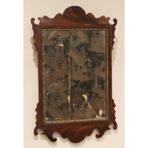 691 - A Georgian style mahogany fretwork mirror, the plate 40.5cm x 28.5cm, the frame 62cm x 39.5cm overal... 