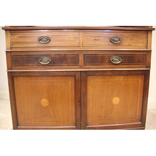 833 - An Edwardian mahogany and satinwood crossbanded washstand, the three quarter gallery with urn finial... 