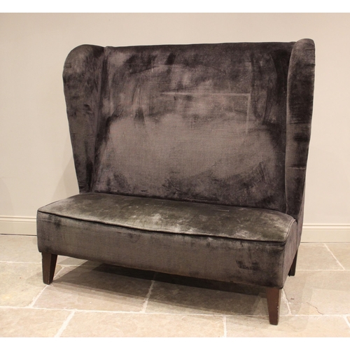 842 - A velvet upholstered wing back porters/office settle, late 20th century, the padded wing backs over ... 