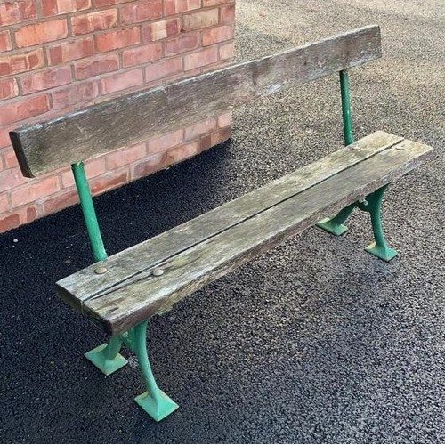 543 - A late 19th century painted iron and hardwood garden bench, the cast 'X' frame supports extending to... 