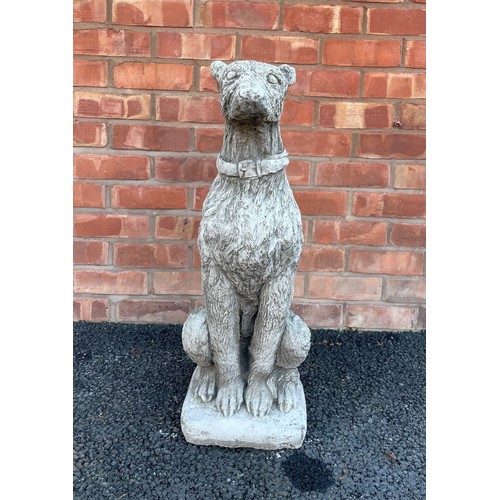 553A - A reconstituted garden figure of an Irish Wolf hound, modelled seated, 74cm high