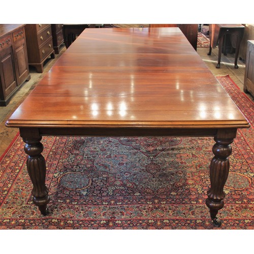 802 - A 19th century style extending mahogany dining table, 20th century, the rectangular moulded top rais... 