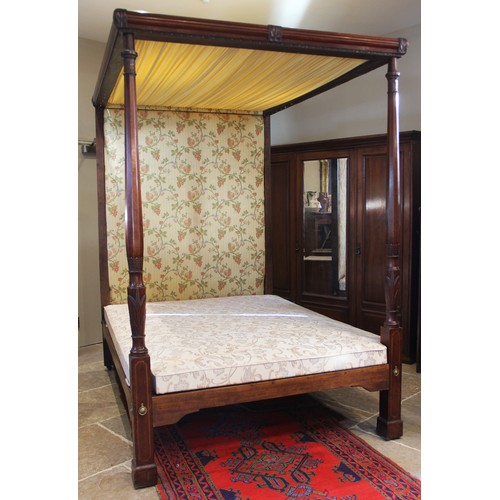 815 - A 19th century mahogany tester bed, the moulded frame and foliate fabric canopy applied with leafy s... 