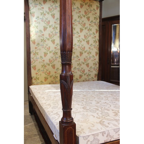 815 - A 19th century mahogany tester bed, the moulded frame and foliate fabric canopy applied with leafy s... 