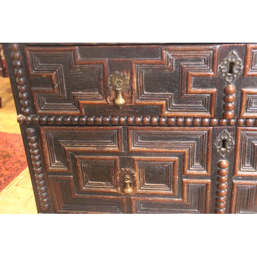 724 - A Jacobean oak chest of drawers, late 17th century, the twin plank top above an arrangement of three... 