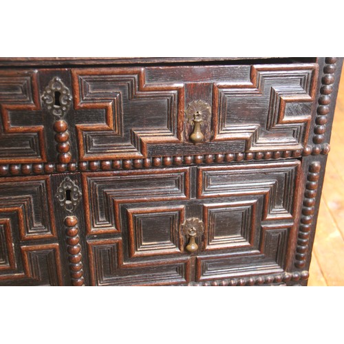 724 - A Jacobean oak chest of drawers, late 17th century, the twin plank top above an arrangement of three... 