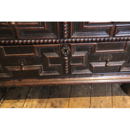 724 - A Jacobean oak chest of drawers, late 17th century, the twin plank top above an arrangement of three... 