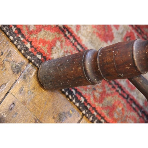 760 - A late 18th/early 19th century primitive ash and elm comb back Windsor chair, probably Thames Valley... 