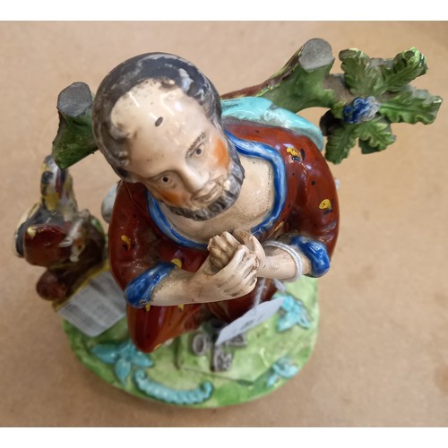 469 - A Staffordshire figure titled 'Saint Peter', early 19th century, modelled kneeling with crossed keys... 