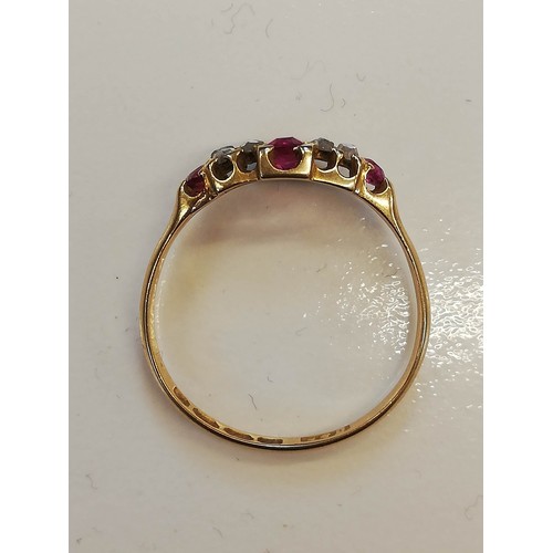 70 - A Victorian ruby and diamond 18ct gold ring, the lozenge shaped head set with two mixed cut rubies, ... 