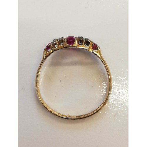 70 - A Victorian ruby and diamond 18ct gold ring, the lozenge shaped head set with two mixed cut rubies, ... 