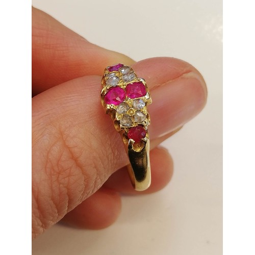 70 - A Victorian ruby and diamond 18ct gold ring, the lozenge shaped head set with two mixed cut rubies, ... 