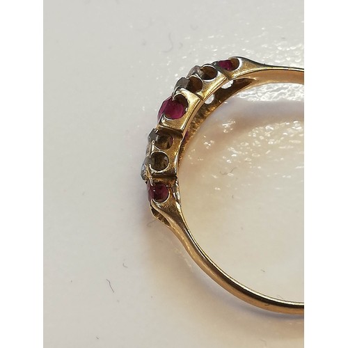 70 - A Victorian ruby and diamond 18ct gold ring, the lozenge shaped head set with two mixed cut rubies, ... 