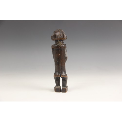 454 - A selection of African works of art, 20th century, to include a Pende mask, 32cm long, a small Hemba... 