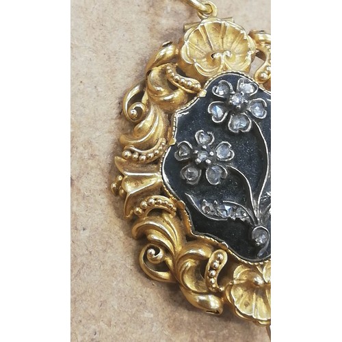 124 - A William IV mourning pendant brooch, the central black enamelled lozenge shaped panel with applied ... 