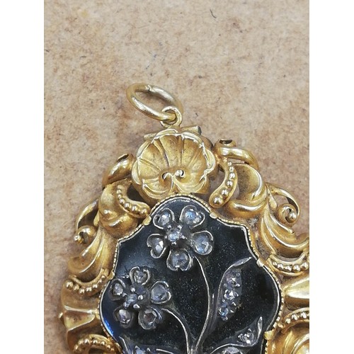 124 - A William IV mourning pendant brooch, the central black enamelled lozenge shaped panel with applied ... 