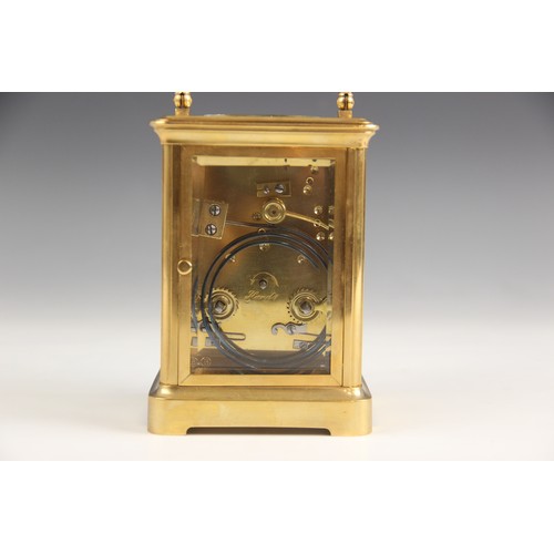 688 - A brass cased carriage clock, by Henry Marc Paris, late 19th/early 20th century, the bevelled glass ... 