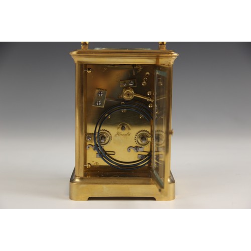 688 - A brass cased carriage clock, by Henry Marc Paris, late 19th/early 20th century, the bevelled glass ... 