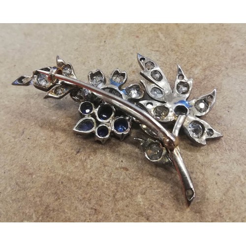 82 - A Victorian diamond and sapphire floral spray brooch, the floral head comprising five mixed cut sapp... 