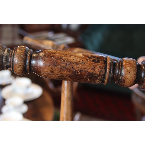 818 - A well matched set of six Victorian elm and ash kitchen chairs, each with a serpentine lath back ove... 