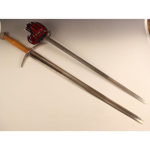 662 - Four modern re-enactment swords, comprising a two handed broadsword, 112cm long overall, a rapier ty... 