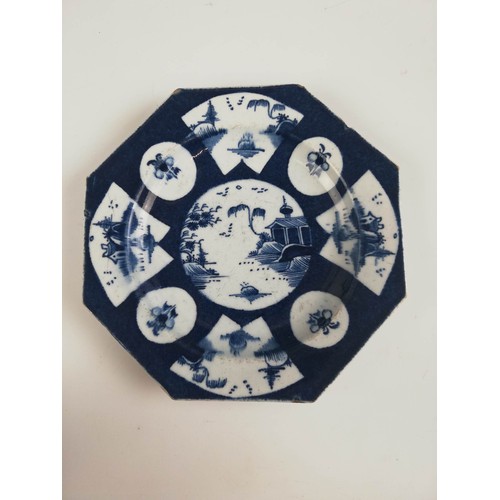 473 - A pair of Worcester porcelain octagonal plates, circa 1770, each powder blue ground plate with a cen... 