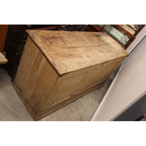 798 - A Victorian pine work bench/dresser, the plank top above three frieze drawers, upon panelled end sup... 