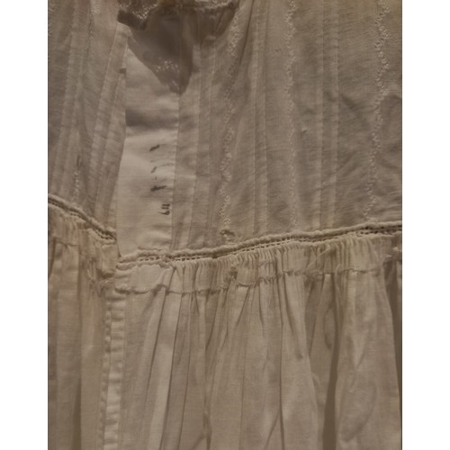 598 - Four early 20th century christening gowns, in fine white cotton, all with broderie anglaise, fine pl... 