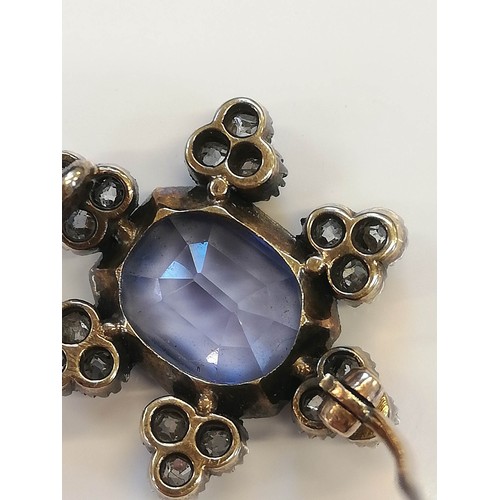 101 - A Victorian sapphire and diamond cluster brooch, the central rectangular mixed cut sapphire with can... 