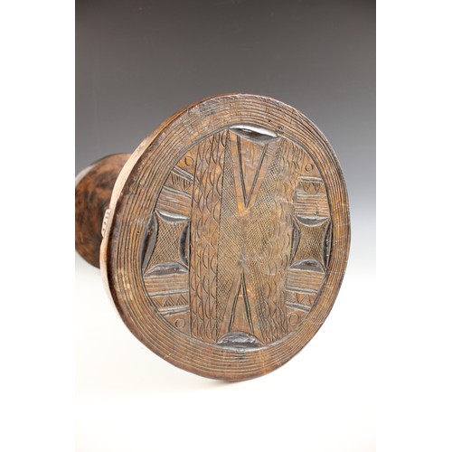 430 - A Southern African Shona Zimbabwe tribal art stool with figure and carved designed to the top, 53cm ... 