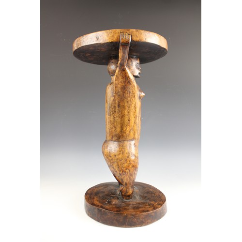 430 - A Southern African Shona Zimbabwe tribal art stool with figure and carved designed to the top, 53cm ... 