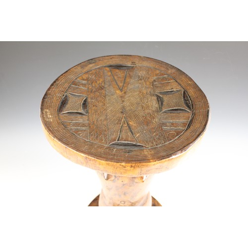 430 - A Southern African Shona Zimbabwe tribal art stool with figure and carved designed to the top, 53cm ... 