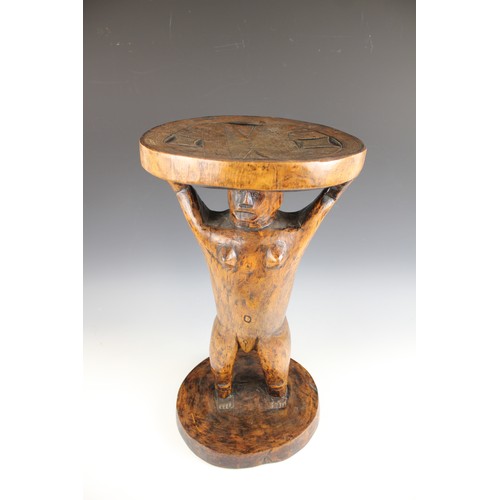 430 - A Southern African Shona Zimbabwe tribal art stool with figure and carved designed to the top, 53cm ... 