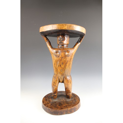 430 - A Southern African Shona Zimbabwe tribal art stool with figure and carved designed to the top, 53cm ... 