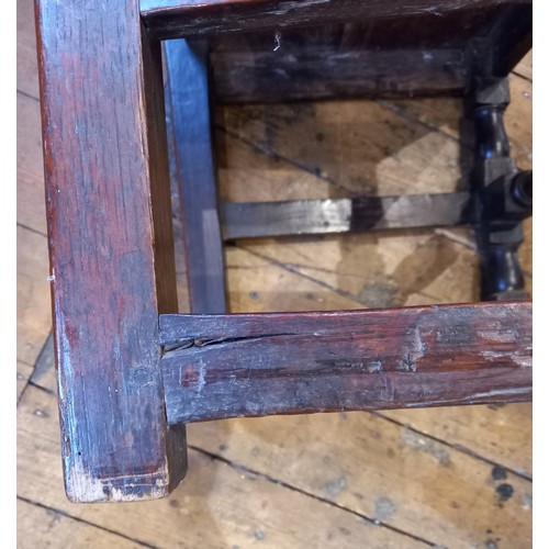 708 - A near pair of early 18th century oak chairs, each with a vase shaped splat over a board seat, raise... 