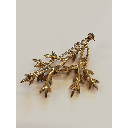 119 - A 9ct gold pearl set foliate spray brooch, designed as a branch with textured leaves and cultured pe... 